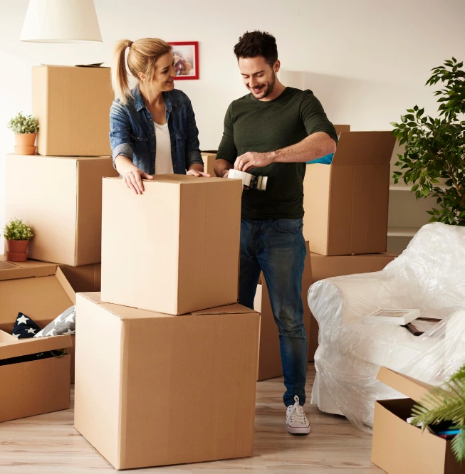 couple-packing-stuff-among-plenty-cardboard-boxes